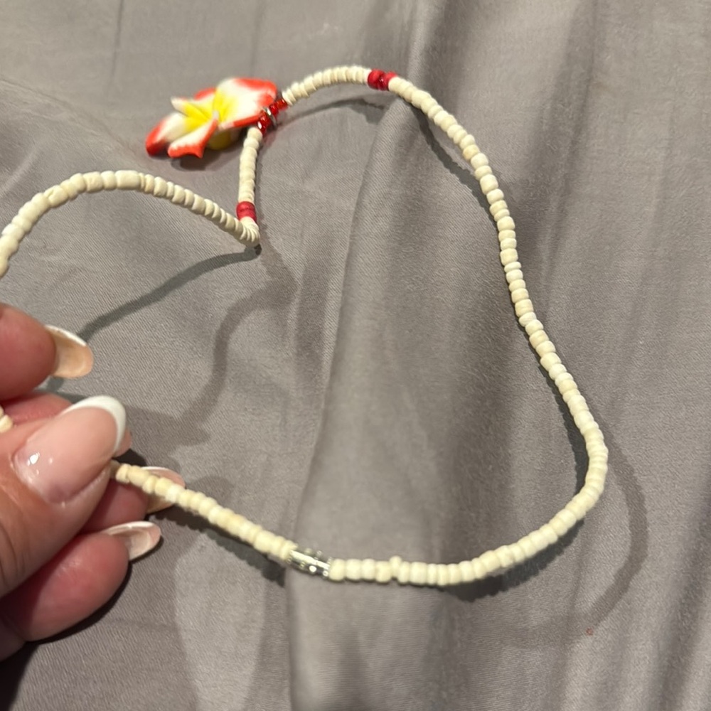 Hawaiis famous clam shell Elegant Floral Necklace with Red and Yellow Accents - Picture 4 of 7